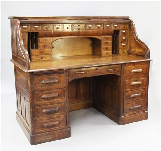 An early 20th century oak roll top desk, W.5ft